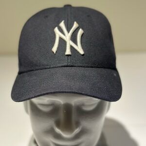 Genuine Merchandise Black Cap with White Tag Detailing